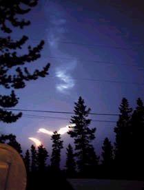 Residents of Canada's Yukon Territory saw this contrail as the Tagish Lake meteorite fell to Earth on Jan. 18, 2000. Researchers are simulating meteorite and comet impacts to determine whether they could have contributed to the emergence of life some 4 billion years ago.